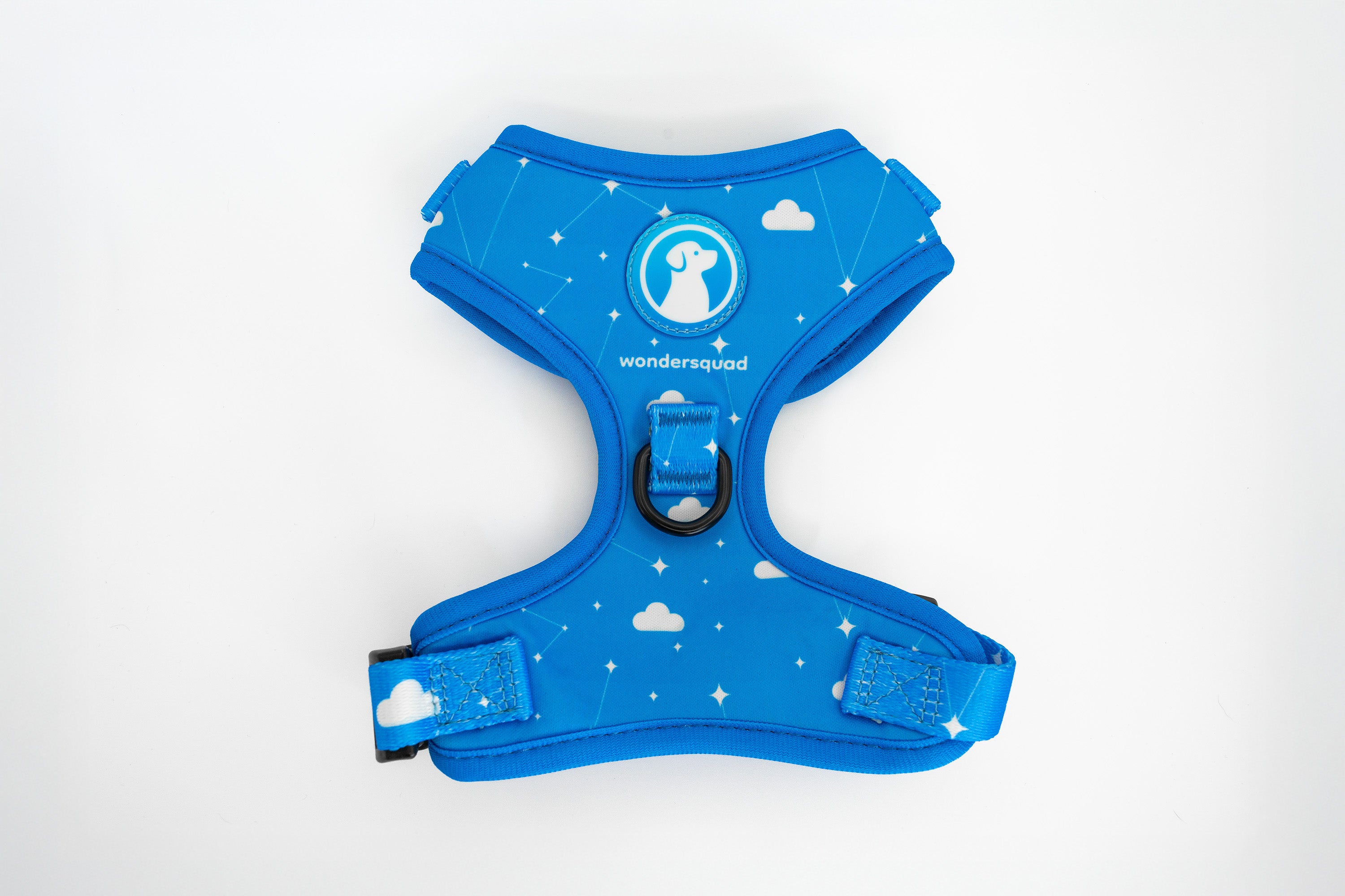 Blue dog harness with cloud and star pattern on a white background